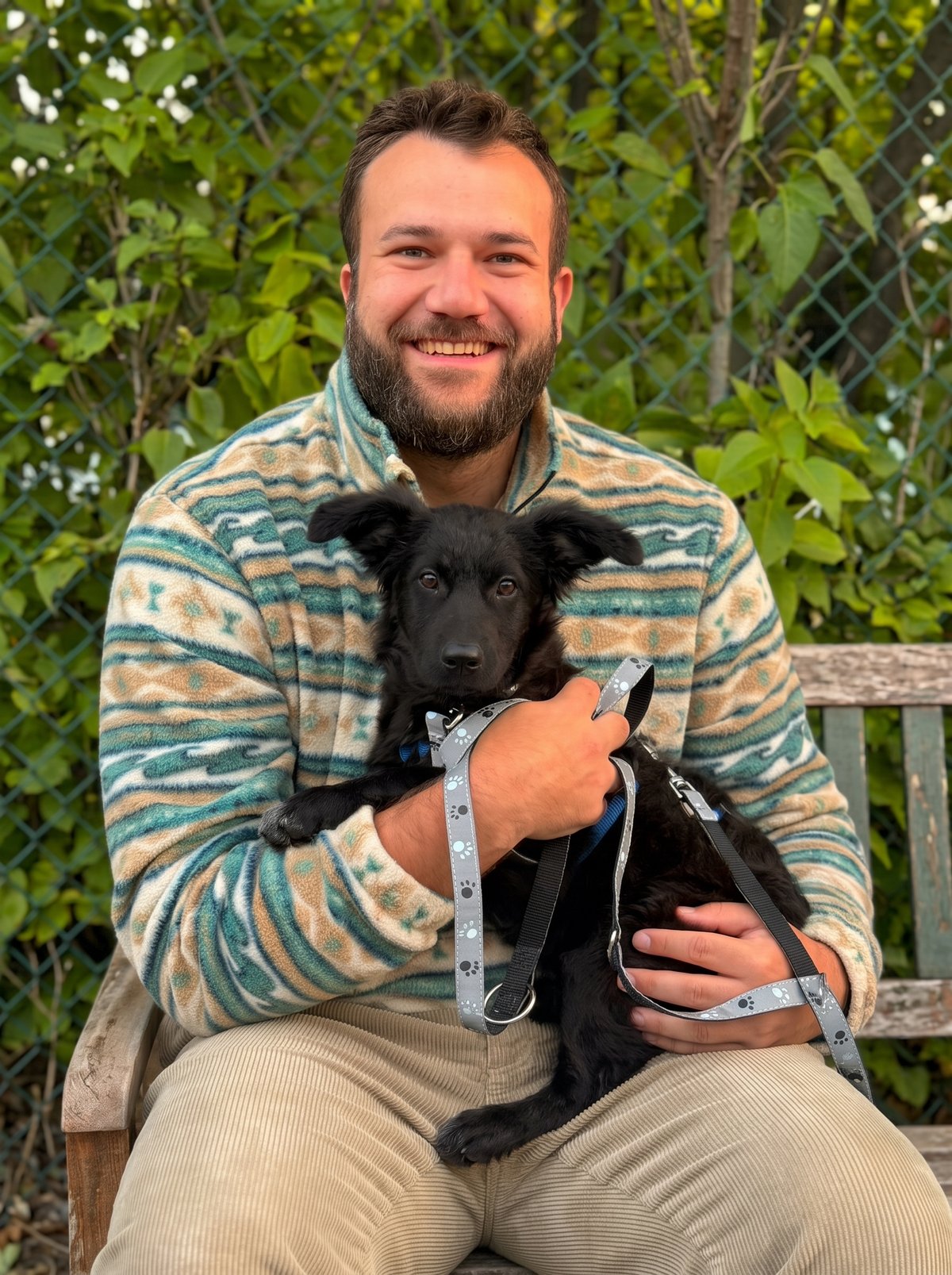 Max Wischow with his puppy outdoors